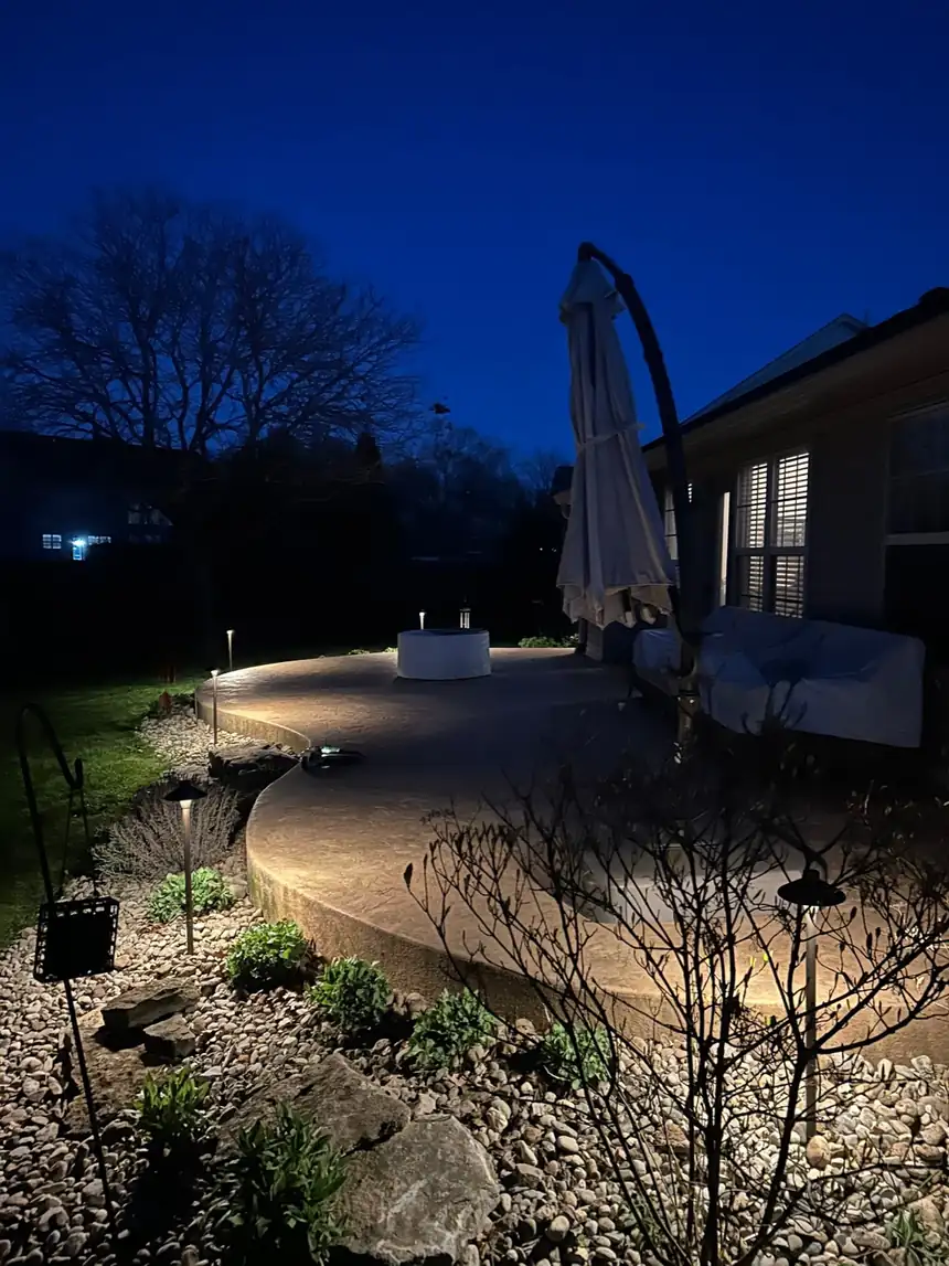 Veteran-owned landscape lighting on a Central Kentucky home after dark by Evening Glow LLC